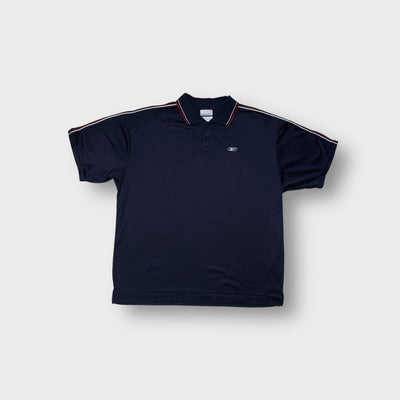 Reebok polo shirt in navy blue with red piping on collar and embroidered chest logo