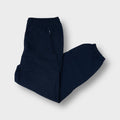 Reebok trackpants in black featuring an embroidered vector logo and zipped pocket