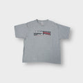 Adidas grey T-Shirt featuring printed logo graphics across the front chest