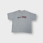 Adidas grey T-Shirt featuring printed logo graphics across the front chest