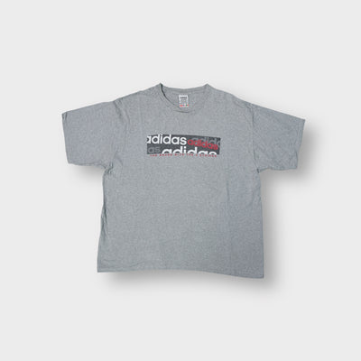 Adidas grey T-Shirt featuring printed logo graphics across the front chest