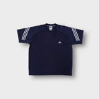 Navy blue Adidas V-neck shirt with white three-stripe details on the sleeves