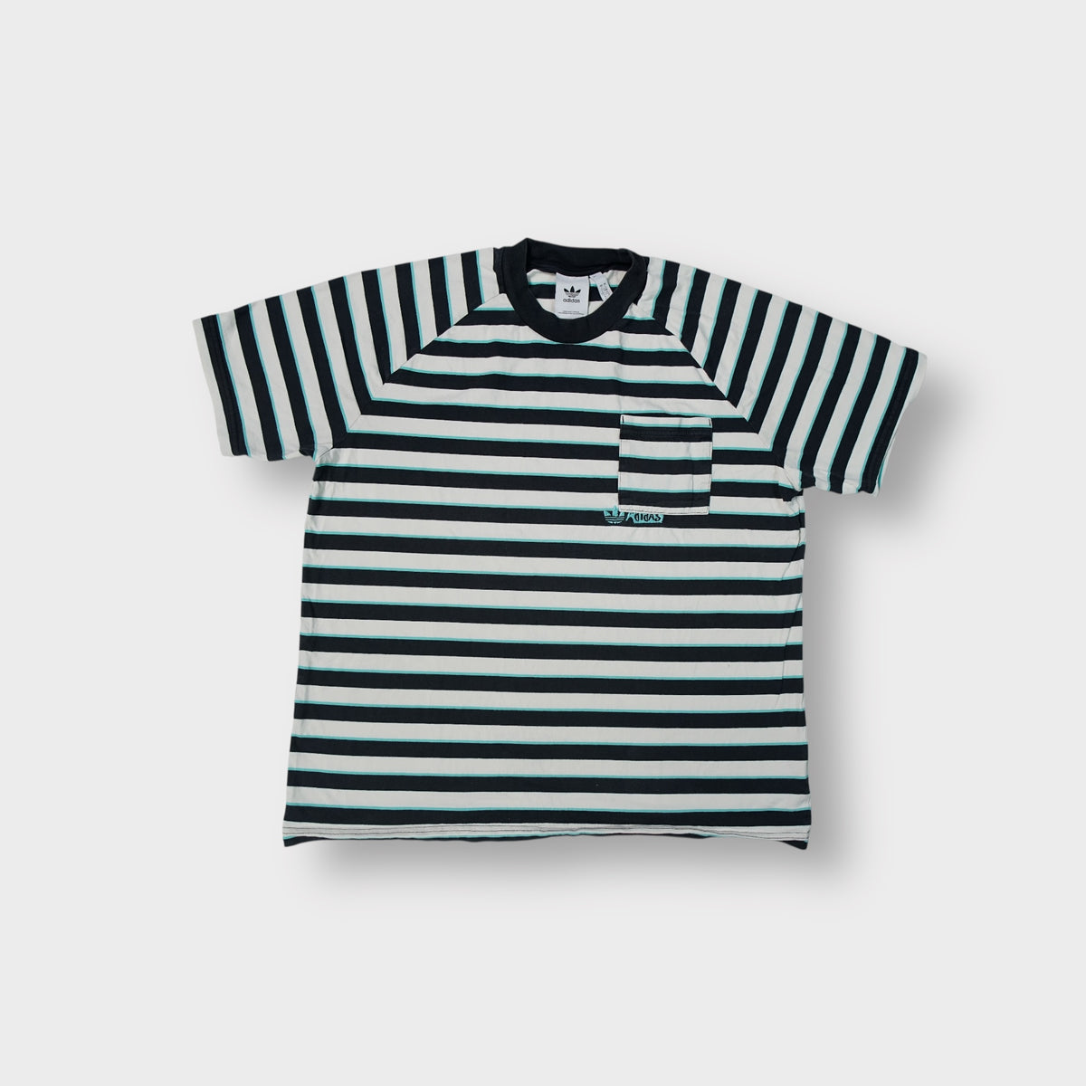 Adidas T-Shirt in white with dark stripes, chest pocket, and turquoise embroidered logo