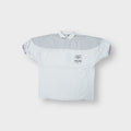 Adidas polo shirt in white with tennis patches on the chest