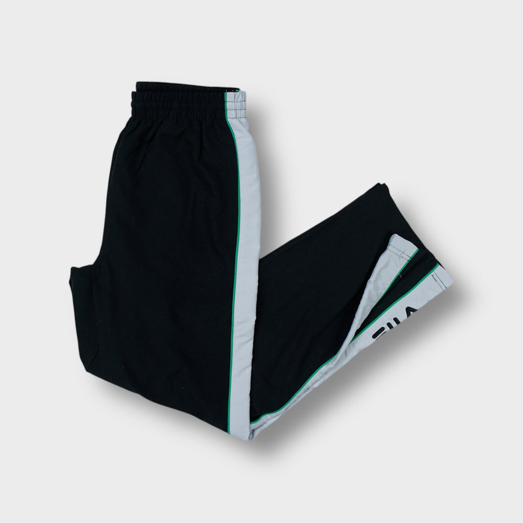 Black Fila trackpants with white side stripes and embroidered logo on the lower leg