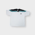 Adidas vintage shirt in white featuring black and green shoulder panels and a V-neck