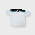 Adidas vintage shirt in white featuring black and green shoulder panels and a V-neck