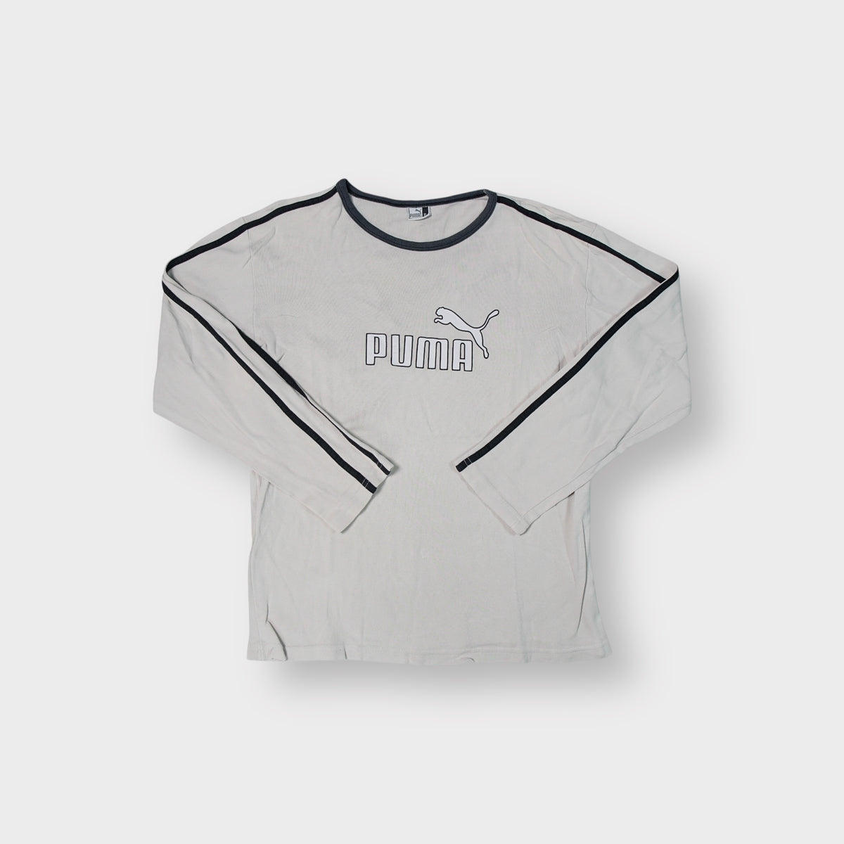 Beige Puma long-sleeve sweater featuring dark trim and printed chest logo