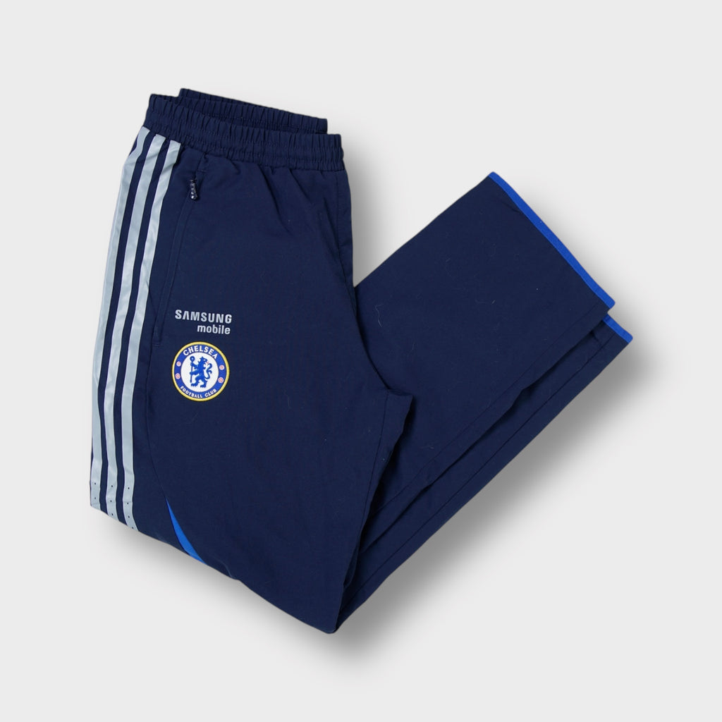 Adidas FC Chelsea navy blue trackpants featuring embroidered club crest and three stripes