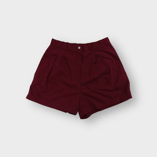 Nike shorts in red with front pleats, button waistband and tonal embroidered logo