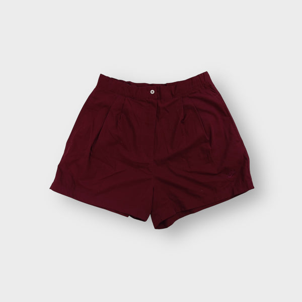 Nike shorts in red with front pleats, button waistband and tonal embroidered logo