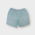 Nike turquoise shorts featuring an integrated webbed belt and front Nike Air patch