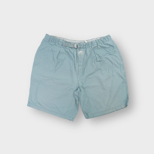 Nike turquoise shorts featuring an integrated webbed belt and front Nike Air patch