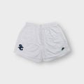 Nike white 90s shorts featuring an embroidered dark green SC emblem on the hem