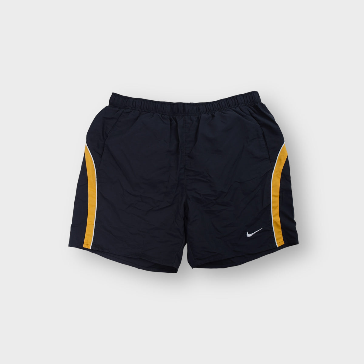 Nike athletic shorts in gray featuring yellow side panel stripes and an embroidered swoosh logo.