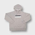 Nike hoodie in beige with an embroidered Swoosh graphic across the chest