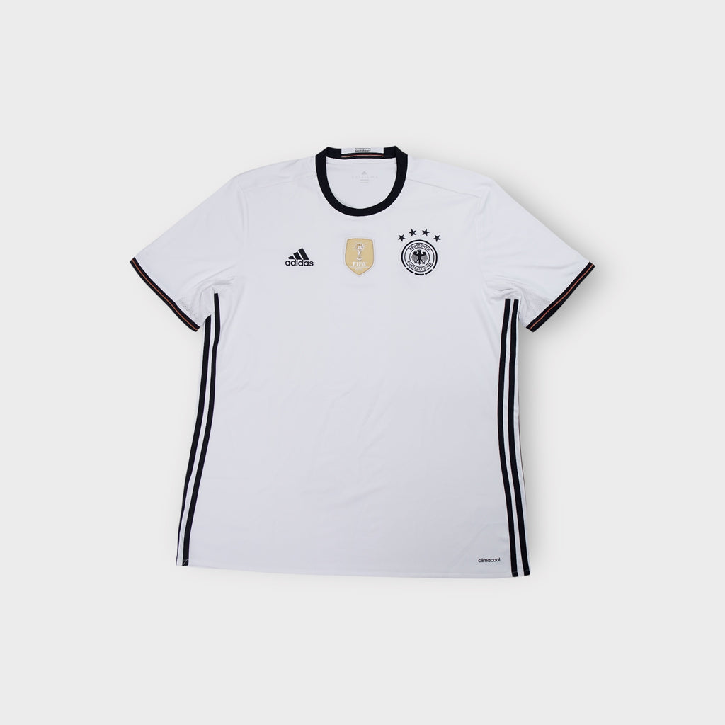 Adidas DFB white football jersey with black collar and central gold FIFA badge.