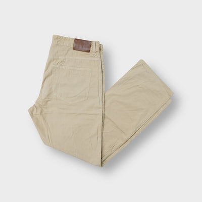 Gant beige cotton trousers featuring a leather logo patch on the back waistband