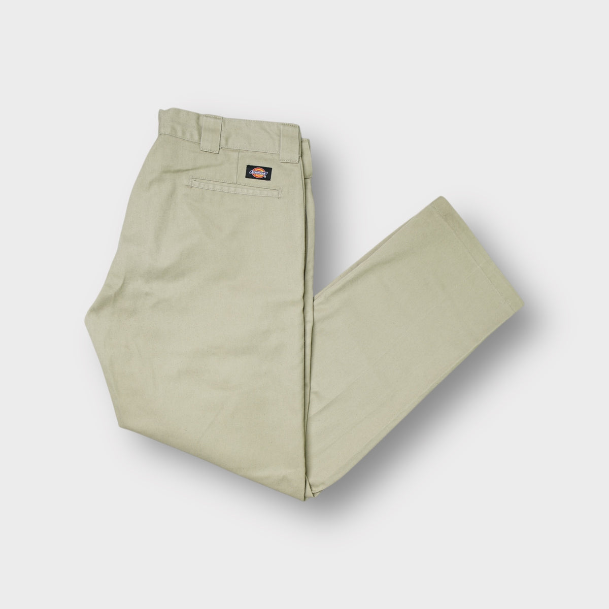 Dickies beige slim straight pants showing the rear waist pocket with a small woven logo patch