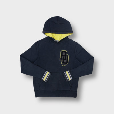 Black Nike hoodie with yellow lined hood and a large chest patch logo