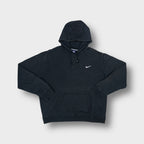 Black Nike hoodie with small white embroidered Swoosh logo on left chest