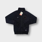 Nike black track jacket with an embroidered Dutch KNVB crest and orange border