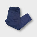 Blue Nike SB trousers featuring an elasticated waistband and straight leg cut