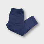 Blue Nike SB trousers featuring an elasticated waistband and straight leg cut