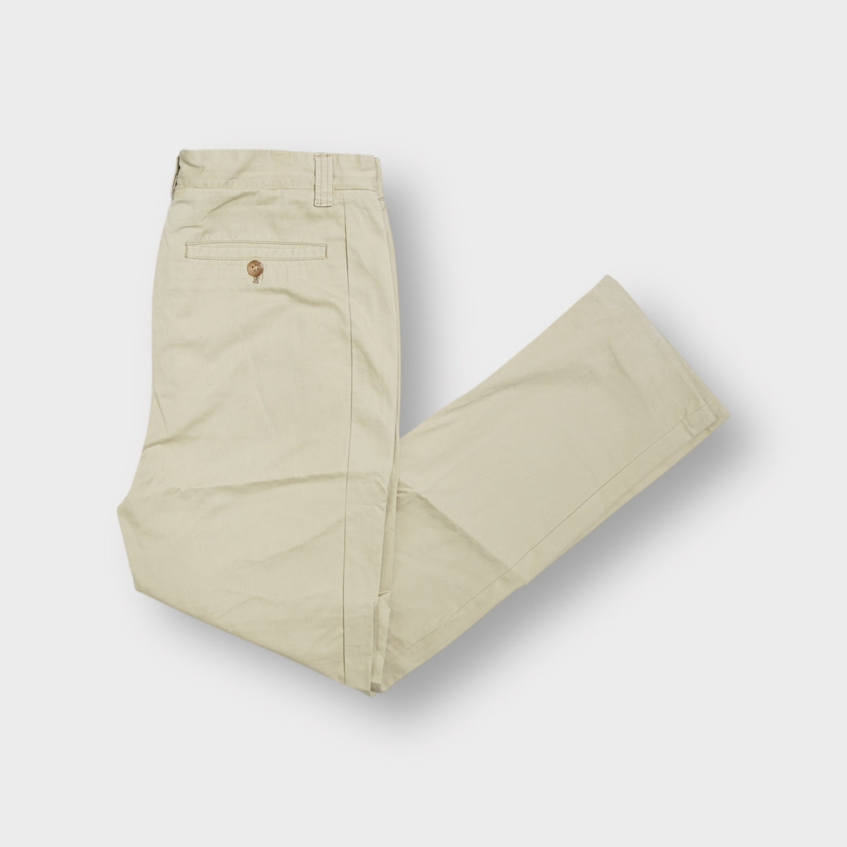 Beige Burberry chino trousers with front pleats and a button waistband closure