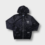 Adidas shiny black Chile 62 track jacket featuring an embroidered trefoil logo