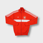 Adidas track jacket in red with Czechoslovakia football crest patch on the chest.