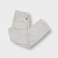 Beige Hugo Boss trousers with zip pocket details and large back pockets