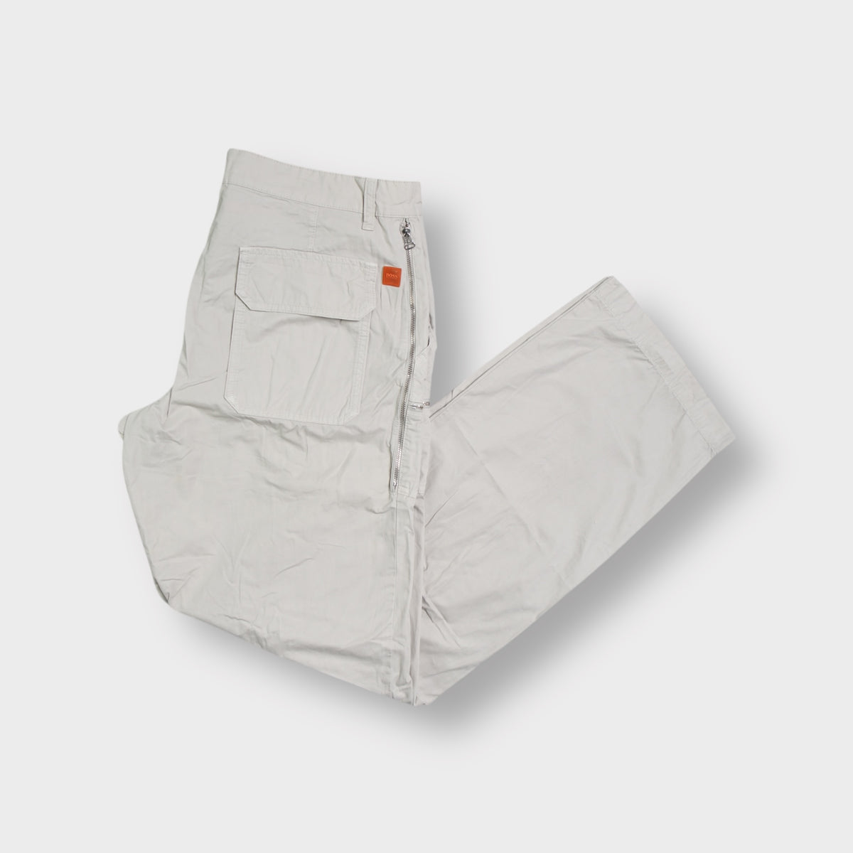 Beige Hugo Boss trousers with zip pocket details and large back pockets
