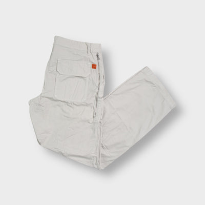 Beige Hugo Boss trousers with zip pocket details and large back pockets