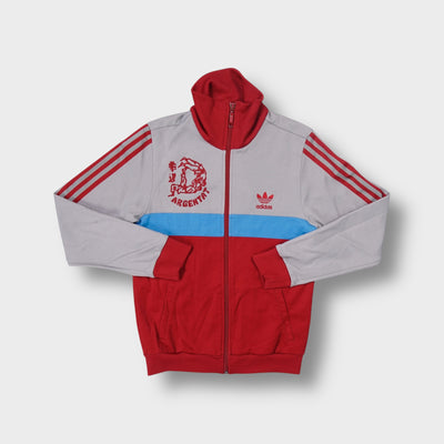 Grey Adidas track jacket with Judo Club Argentat graphic and high red ribbed collar