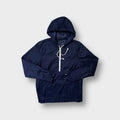 Adidas navy blue windbreaker jacket with a white half-zip and hood drawstrings