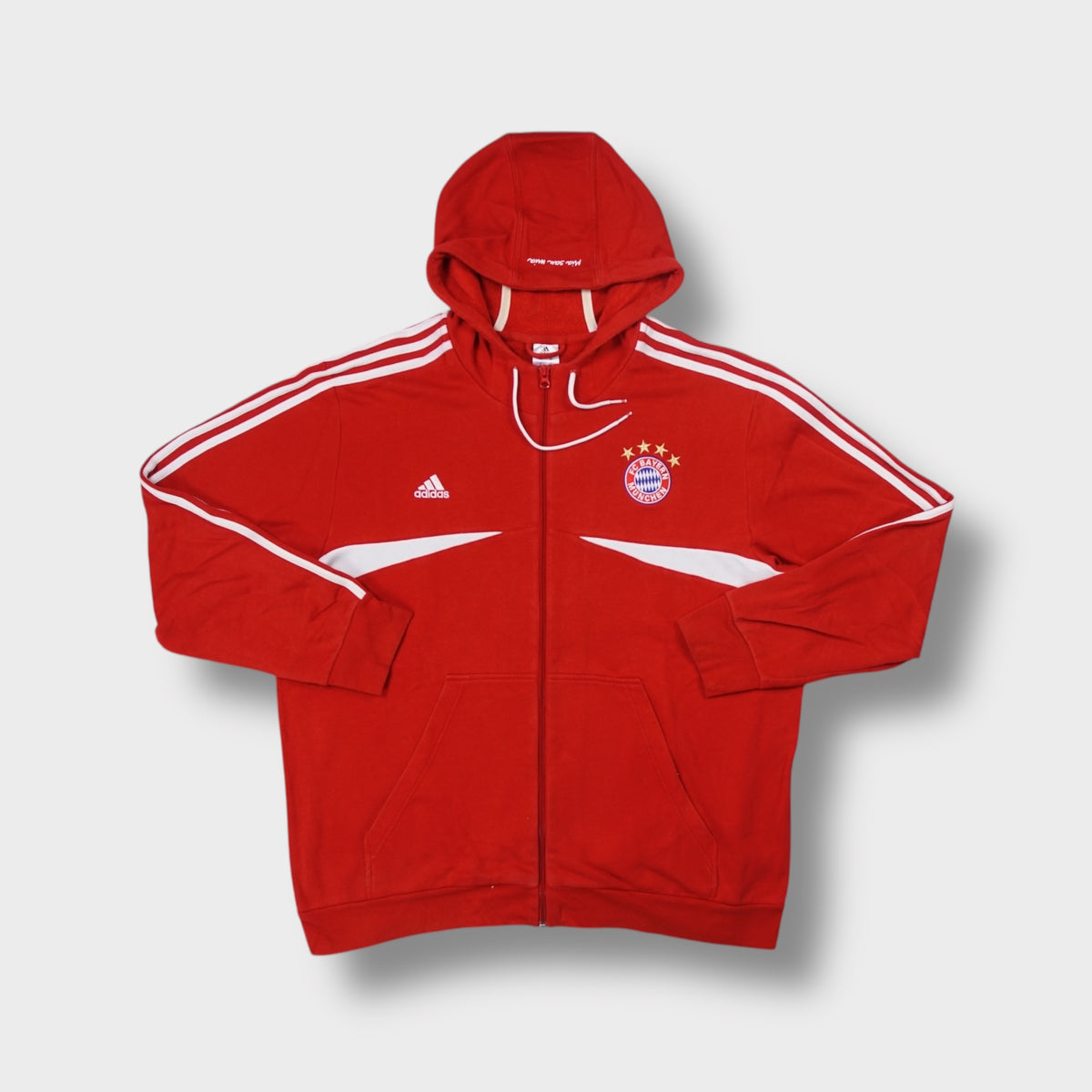 Adidas FC Bayern red zip hoodie with embroidered crest and three white shoulder stripes