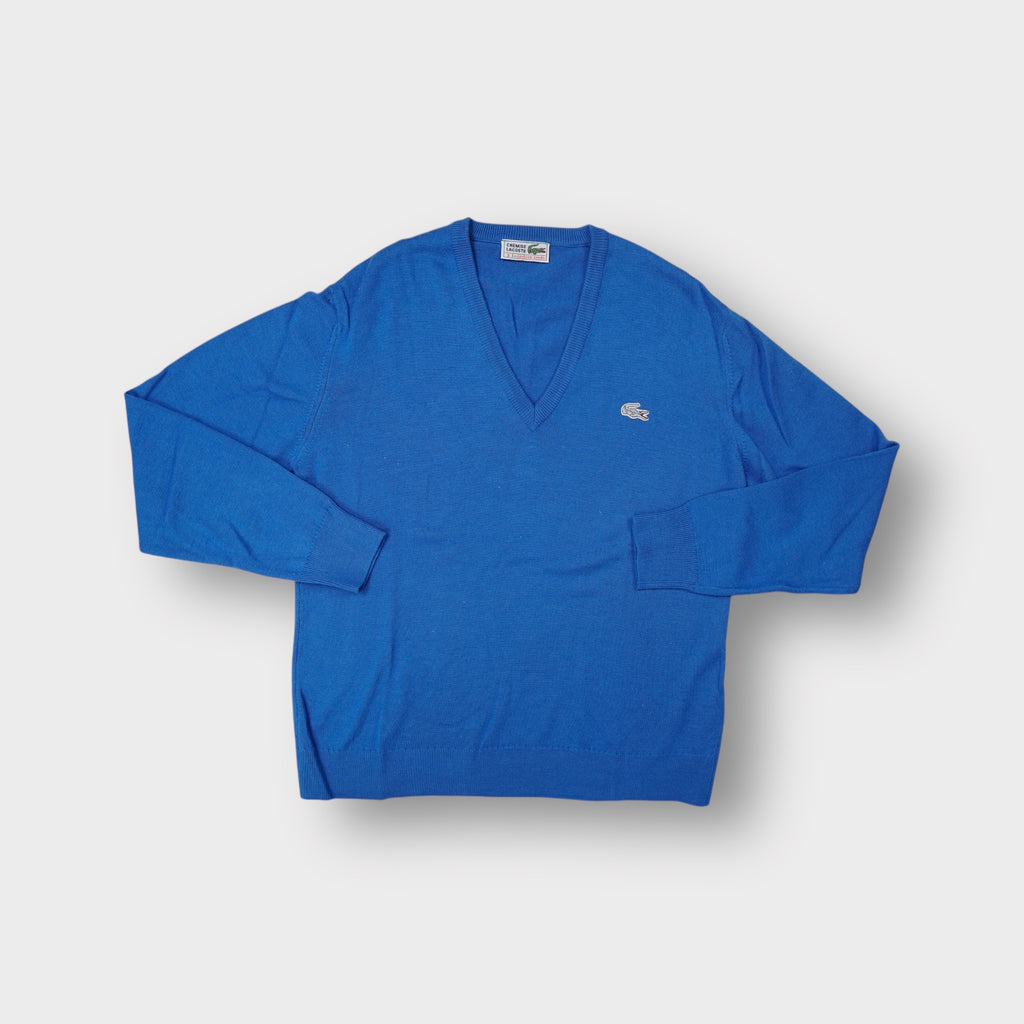 Lacoste V-neck knit sweater in blue featuring an embroidered crocodile logo on the chest.
