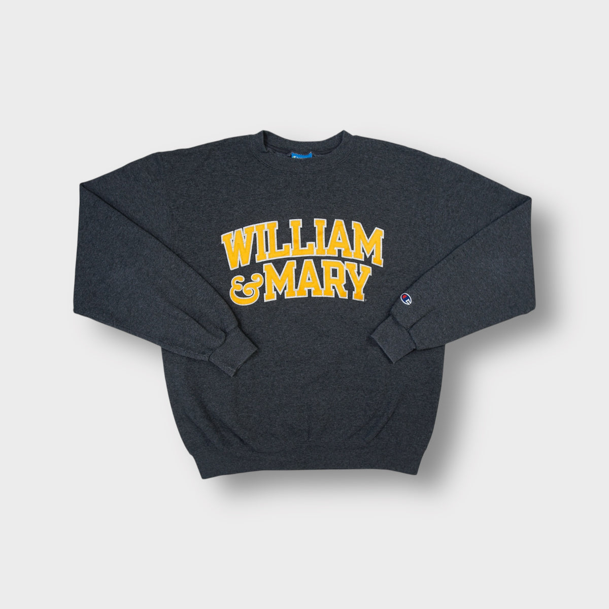 Champion crewneck sweater in grey featuring a yellow William & Mary chest graphic