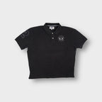 La Martina polo shirt in black featuring an embroidered Tradicion Del Polo Argentino chest logo