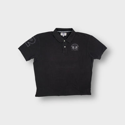 La Martina polo shirt in black featuring an embroidered Tradicion Del Polo Argentino chest logo