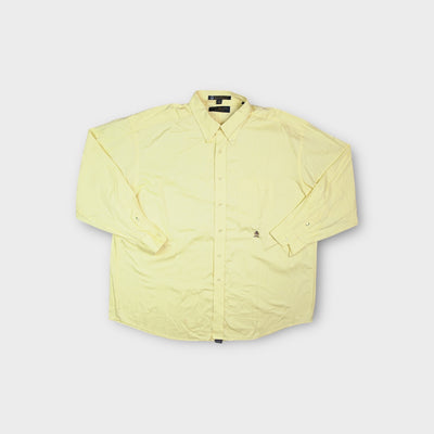 Tommy Hilfiger long sleeve shirt in yellow with a button-down collar and chest pocket.