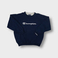 Navy blue Champion crewneck sweater with light grey embroidered script chest logo