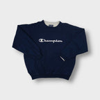 Navy blue Champion crewneck sweater with light grey embroidered script chest logo