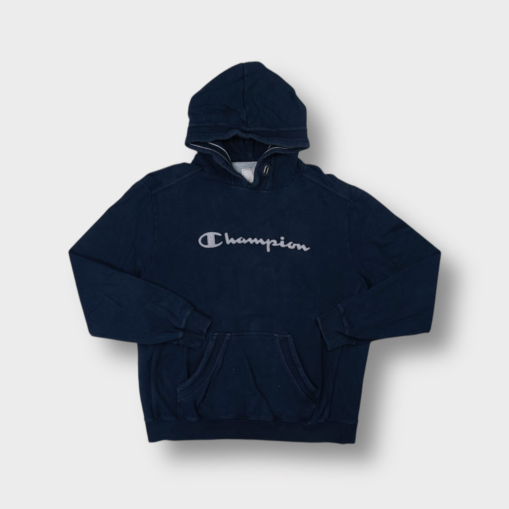 Champion hoodie in navy blue with grey cursive script logo applique on chest