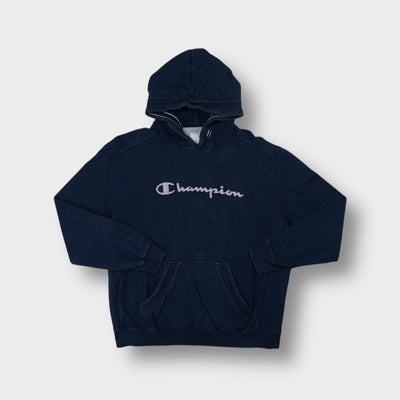 Champion hoodie in navy blue with grey cursive script logo applique on chest