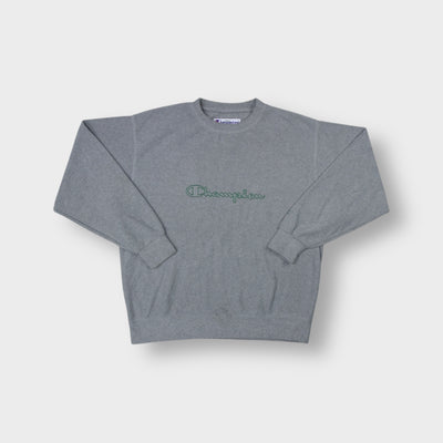 Grey Champion crew neck sweater featuring a green embroidered script logo on the chest