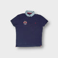 Ralph Lauren navy blue polo shirt with a light denim collar and embroidered flags