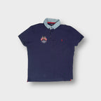 Ralph Lauren navy blue polo shirt with a light denim collar and embroidered flags