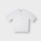 Barbour short-sleeved white polo shirt with green embroidered logo on the chest pocket.